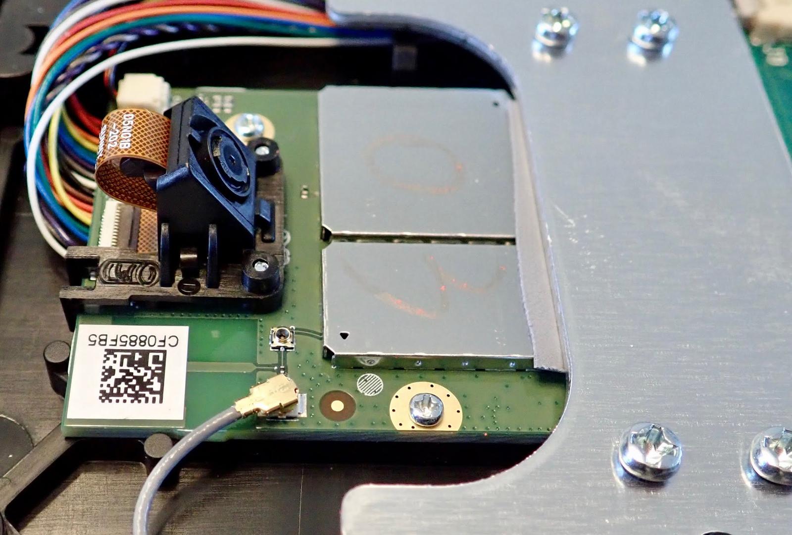 Roomba i7 Teardown: Why is there a waving cat with a lint roller